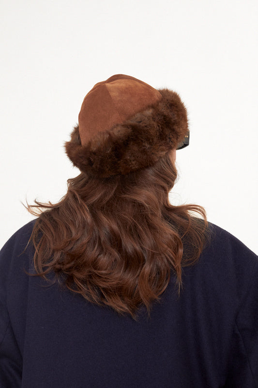 Suede winter hat with fur